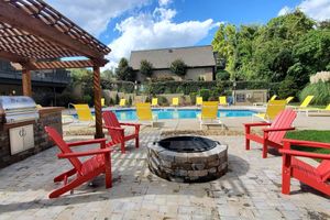 Sit poolside at Kingston Pointe Apartments