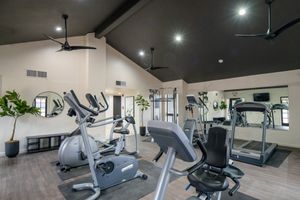 Fitness center equipped with cardio and cable machines at Treehouse in Albuquerque, New Mexico