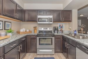 FULLY-EQUIPPED KITCHEN WITH STAINLESS-STEEL APPLIANCES