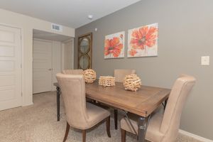 a bedroom with a desk and chair in a room