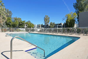 Large blue resort style apartment swimming pool