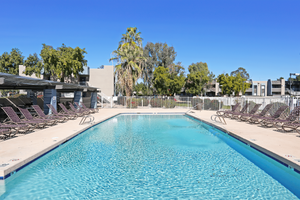 Large blue resort style apartment swimming pool