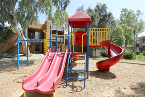 Children's playground with slides and jungle gym
