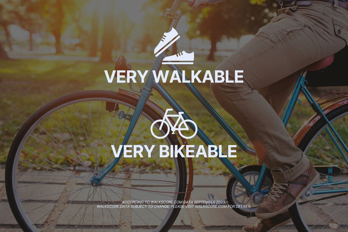 A person riding a blue bicycle on a pathway with trees in the background. Text overlay reads "Very Walkable" and "Very Bikeable," indicating pedestrian and cycling-friendly areas. A note at the bottom references Walk Score data from September 2023.