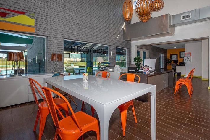a kitchen with an orange umbrella