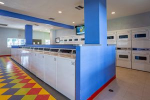 a kitchen with a blue and white tile floor