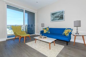 a living room with a blue chair