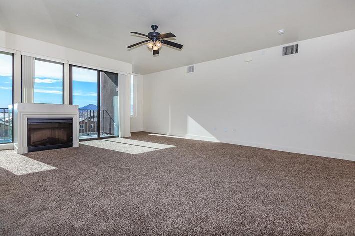 CARPETED FLOORS, CEILING FANS,  AND FIREPLACE AT ECHELON AT CENTENNIAL HILLS IN LAS VEGAS