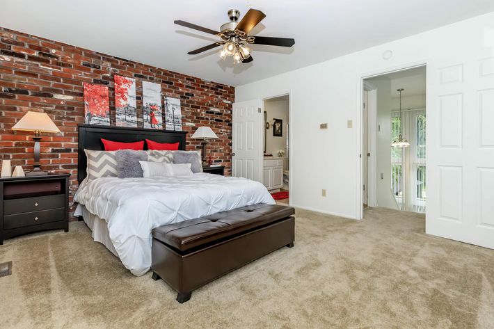 a bedroom with a large bed in a room