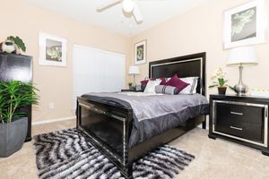 furnished carpeted bedroom
