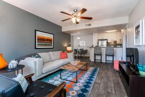 Living Space with Wood-style Flooring - Eden Apartments - Tempe - Arizona