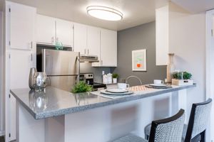 All-Electric kitchen with Breakfast Bar - Eden Apartments - Tempe - Arizona