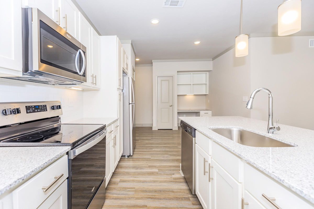 Well-equipped kitchens at Ariza Gosling in Spring, Texas