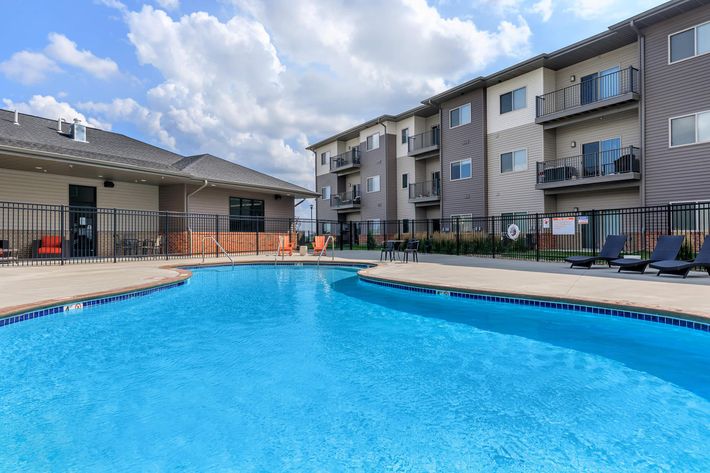 SOAK UP THE SUN AT OUR SHIMMERING SWIMMING POOL AT THE SUMMIT AT SUNNYBROOK VILLAGE