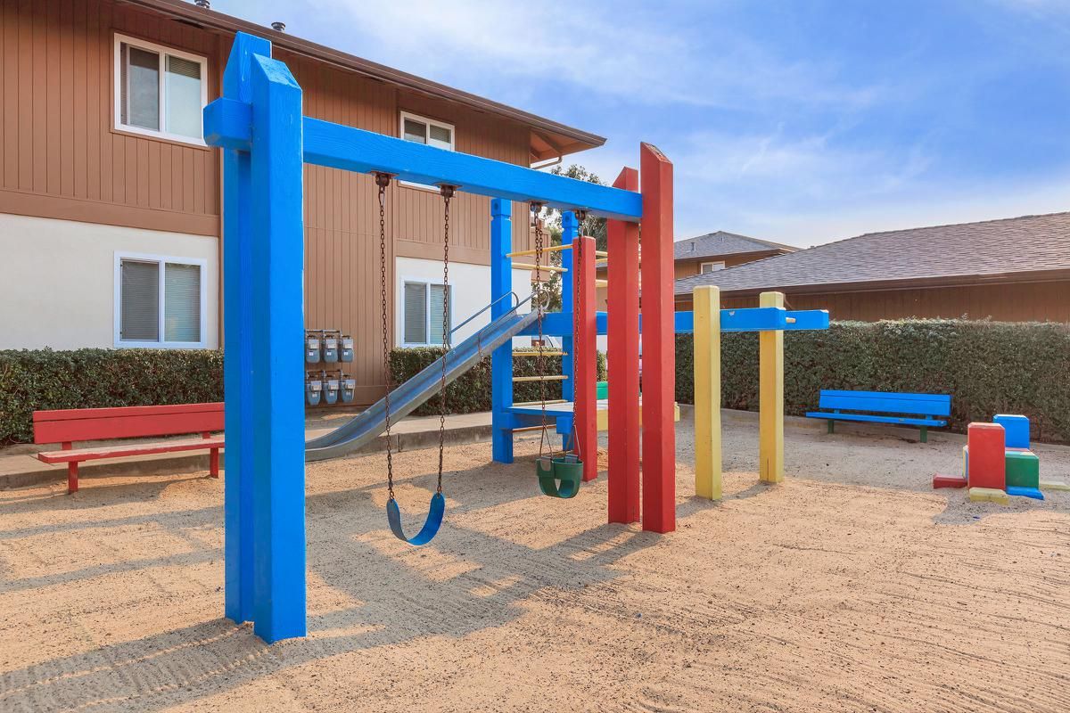 a playground in front of a blue chair