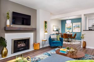 Living Room with Gas Fireplace with Mantle - Huntsview Apartments - Greensboro - North Carolina