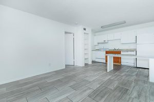 Fresh white apartment with grey tile wood floors