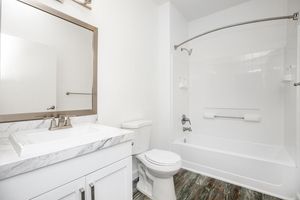 a room with a sink and a mirror