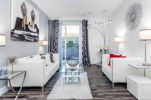a living room filled with furniture and a fireplace