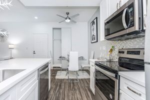 a kitchen with a stove and a sink