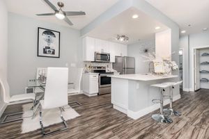a room filled with furniture and a sink