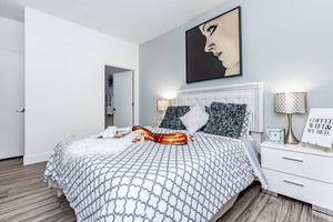 a bedroom with a large bed in a room