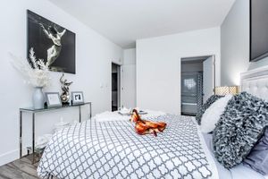 a bedroom with a large bed in a room