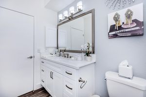 a room with a sink and a mirror