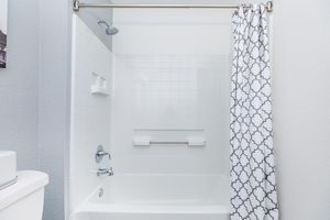 a close up of a sink and a mirror