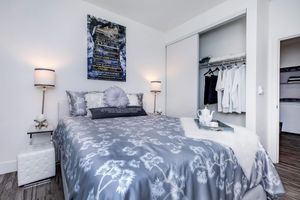 a bedroom with a bed in a room