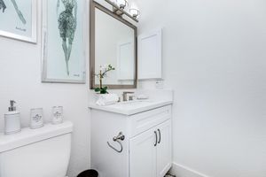 a room with a sink and a mirror