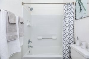 a close up of a sink and a mirror