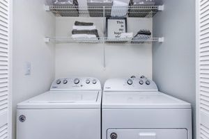 a kitchen with a sink and a mirror