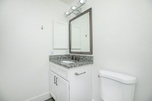 a room with a sink and a mirror