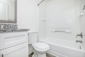 a room with a sink and a mirror