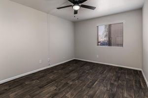 Bedroom with Wood-style flooring - Glenridge Apartments - Glendale - Arizona