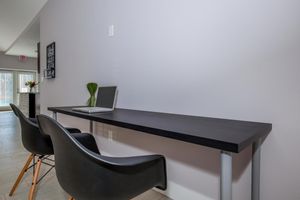 a desk with a chair in a room