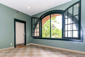 a green tiled wall and a window