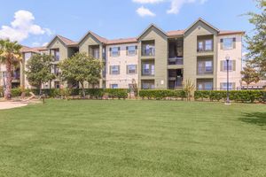Exterior view of residential buildings at The Avenue apartments in Nederland, TX