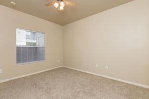 Bedroom with carpeted floors and ceiling fan