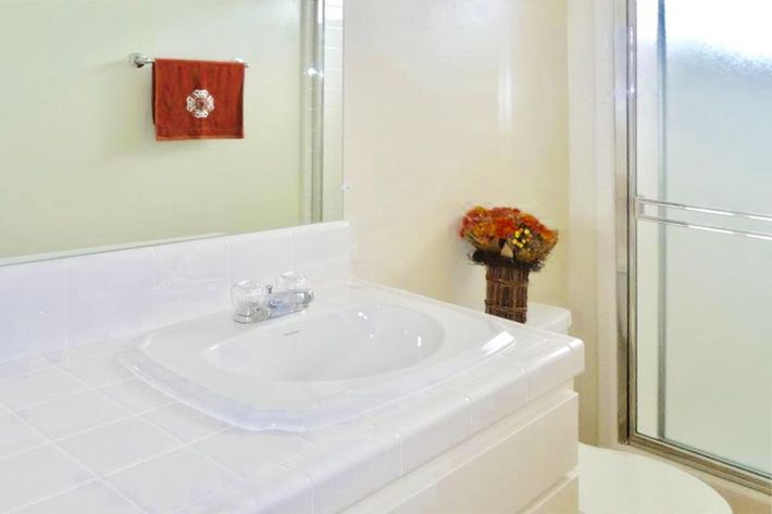 Bathroom with red flowers