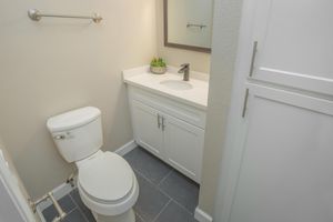 a small white sink in a bathroom