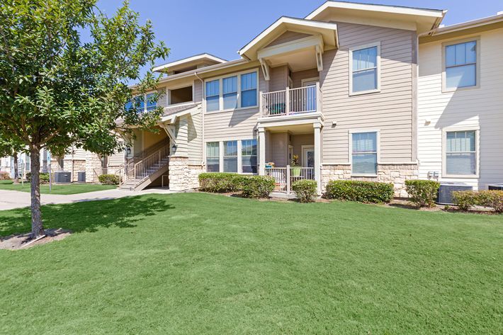 a large lawn in front of a house