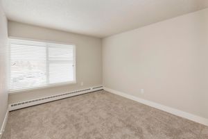 CARPETED BEDROOMS AT AERO PLACE APARTMENTS