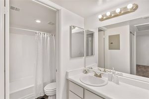 Modern and white bathroom with a separate toilet and shower room