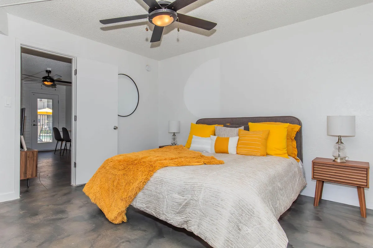 Furnished bedroom shown — representative home at 32 Arcadia Apartments.